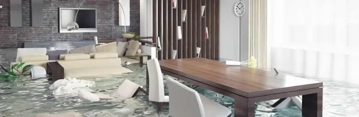 home interior affected by water damage with flooded floors and displaced furniture in Denver, CO